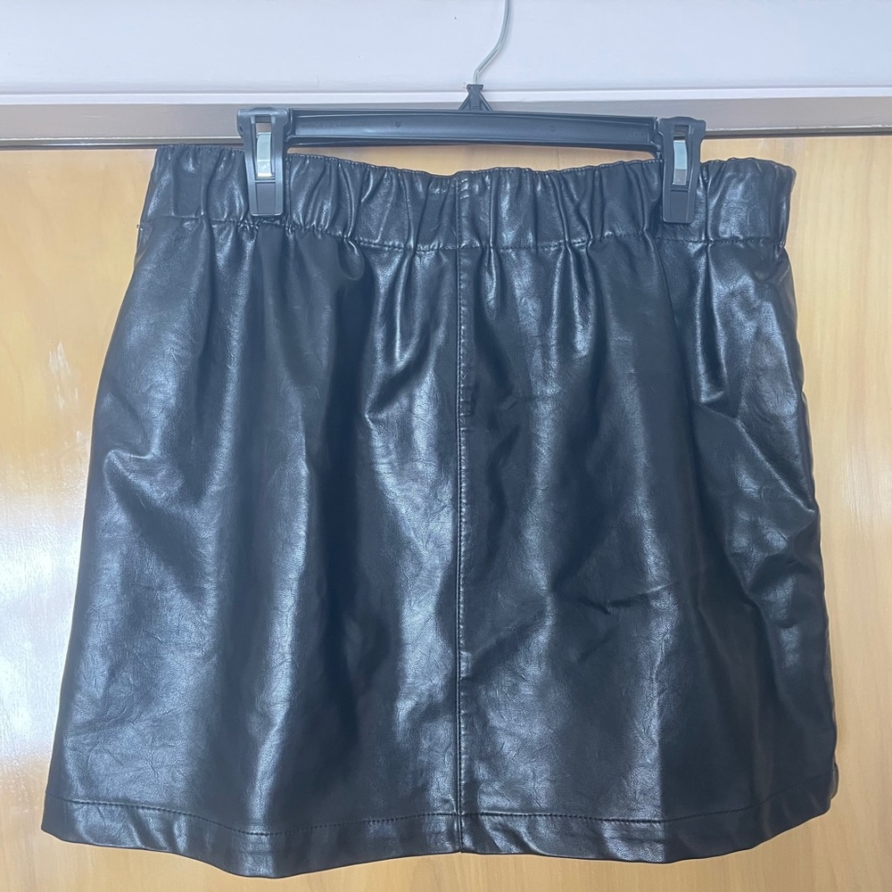 Black faux leather skirt.